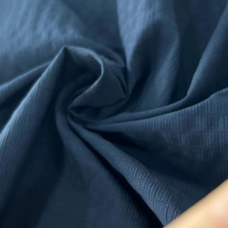 40D+20D*70D+40D+70D 100GSM Recycled Nylon Spandex Fabric 70D Foamed Grid Water Repellent