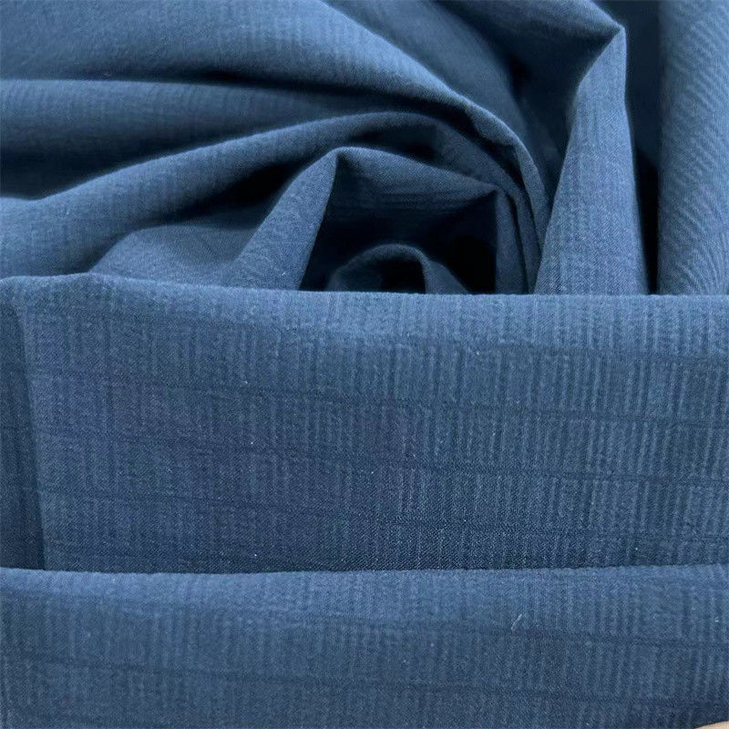 40D+20D*70D+40D+70D 100GSM Recycled Nylon Spandex Fabric 70D Foamed Grid Water Repellent